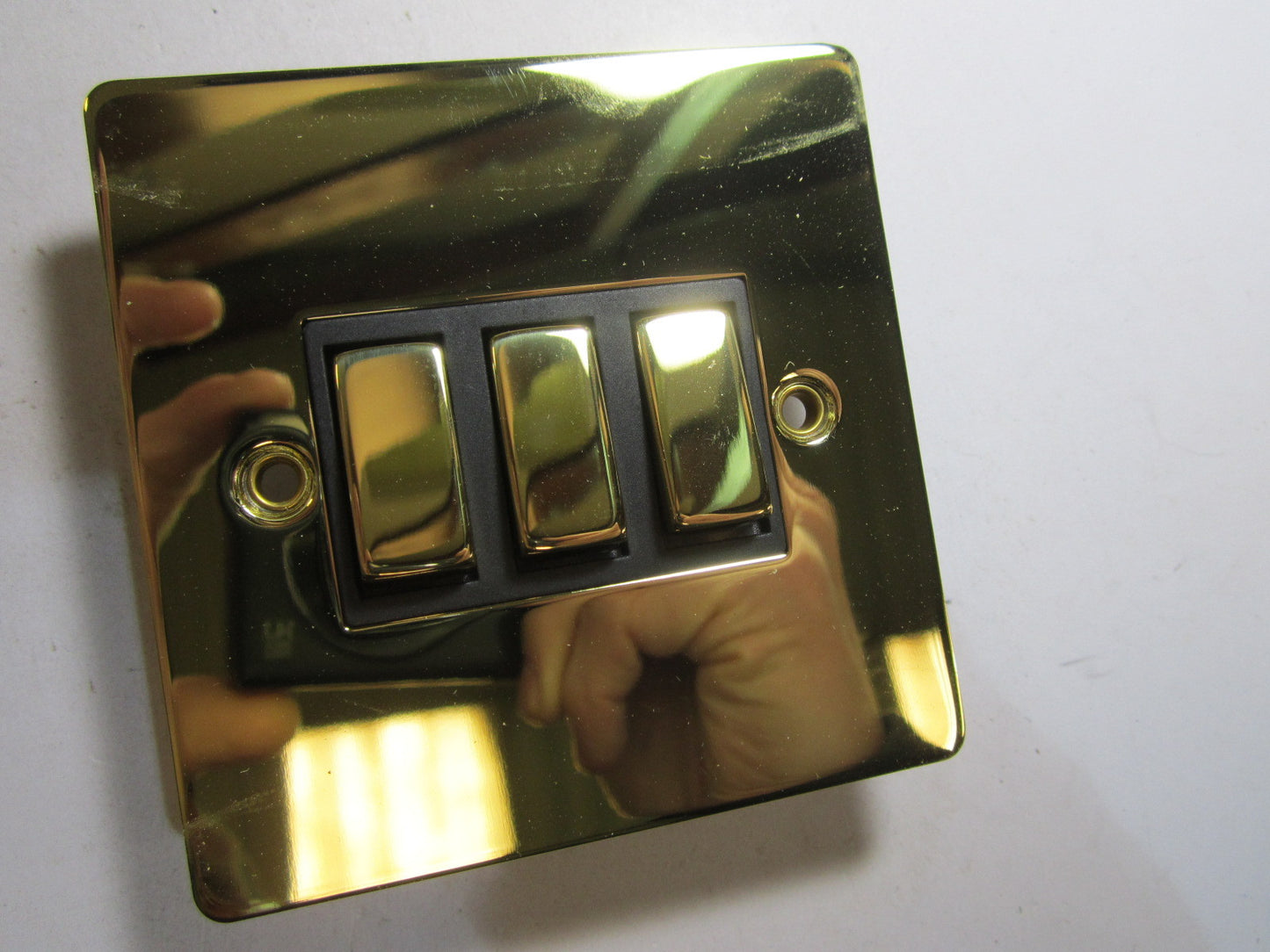 Volex 3 Gang 2 Way Lightswitch 10AX Black Interior Polished Brass Flat Plate