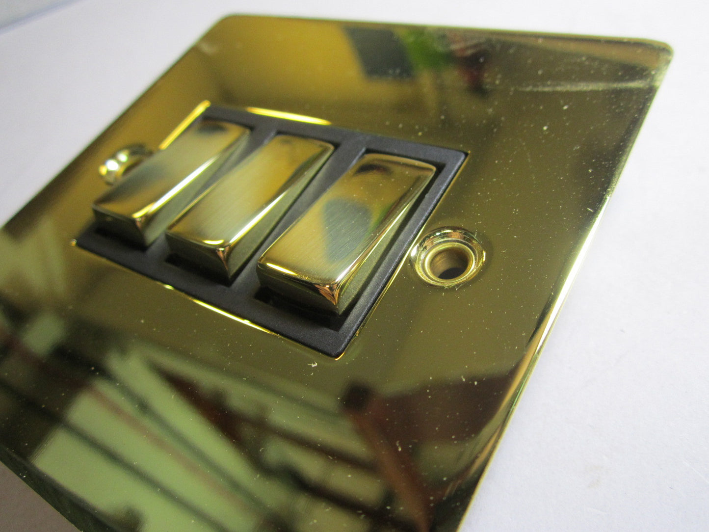 Volex 3 Gang 2 Way Lightswitch 10AX Black Interior Polished Brass Flat Plate