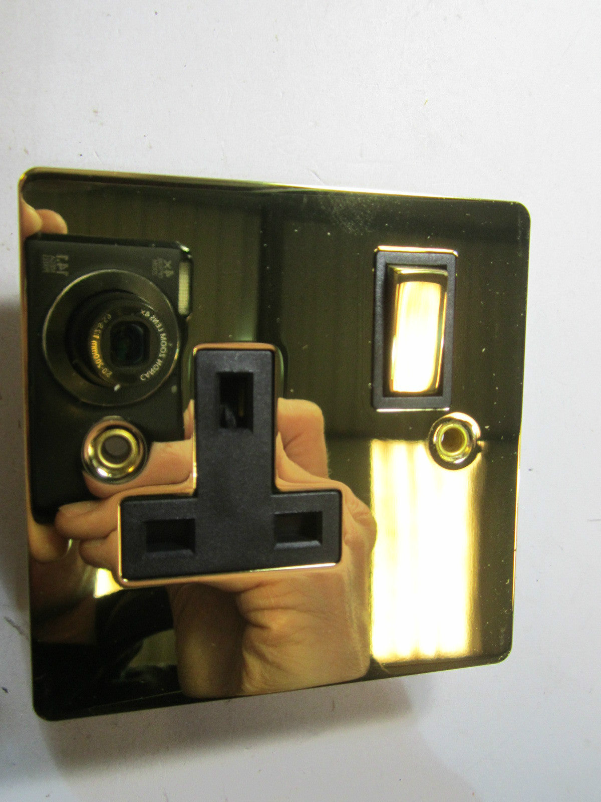 Volex 1 Gang Switched Socket 13A Double Pole Black Interior Polished Brass Flat