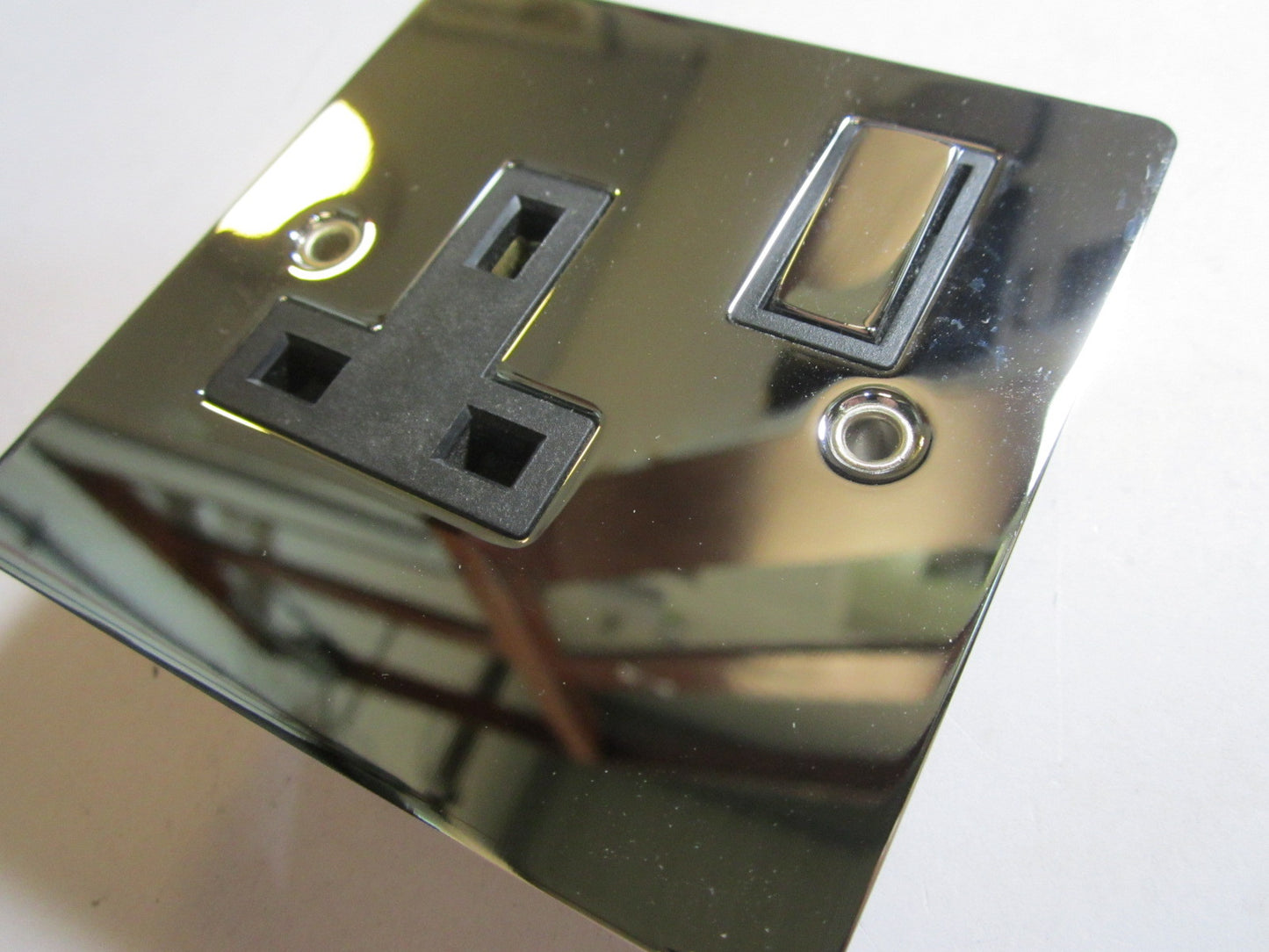 Volex 1 Gang Switched Socket 13A Double Pole Black Interior Polished Chrome Flat